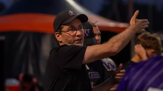 Jamie Clark instructs UW Men's Soccer players during a match against Oregon State