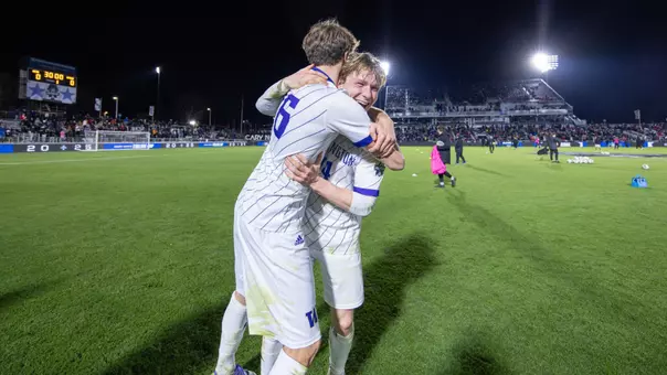Joe Dale celebrates with Zack Meier after the Huskies advance to the National Championship match.