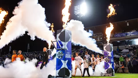 Washington walks on to the pitch ahead of the NCAA Tournament semifinal match against Furman.