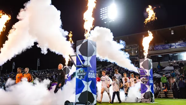 Washington walks on to the pitch ahead of the NCAA Tournament semifinal match against Furman.
