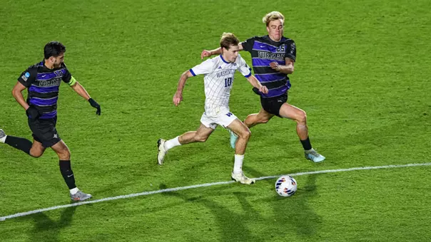 Richie Aman dribbles the ball in the College Cup match against Furman