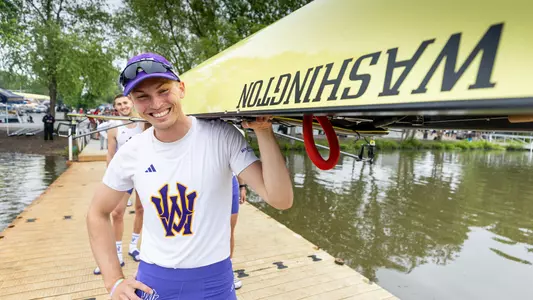 Ryan Martin washington rower holding a boat