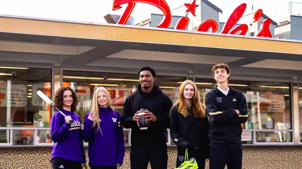 UW athletes in front of Dick's Drive-In