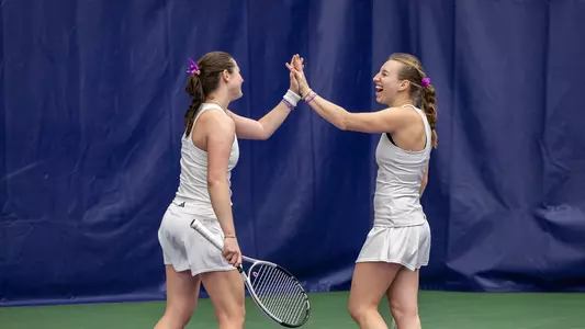McKenna Koenig and Carina Syrtveit high five