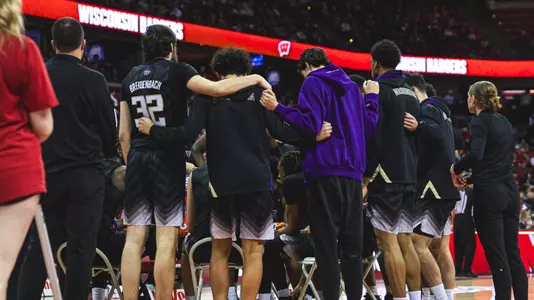 Washington men's basketball huddle at Wisconsin