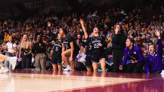 UW WBB bench celebration at Minnesota