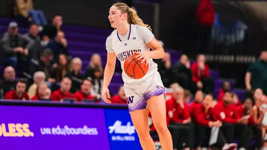 Devin Coppinger dribbles up the court.