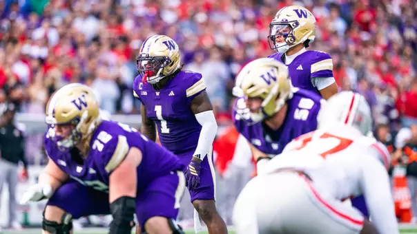 Demond Williams Jr. and Jonah Coleman line up for a play against Ohio State