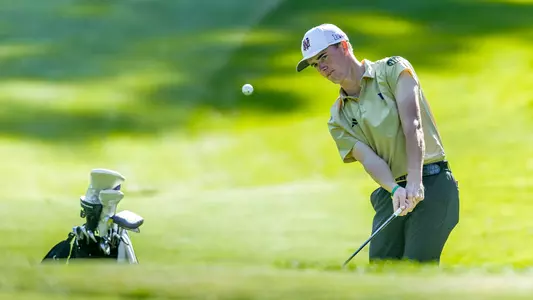 Jack Murphy chips the ball out of the rough