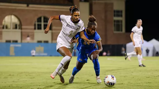 Maya Loudd dribbles past her defender at UCLA
