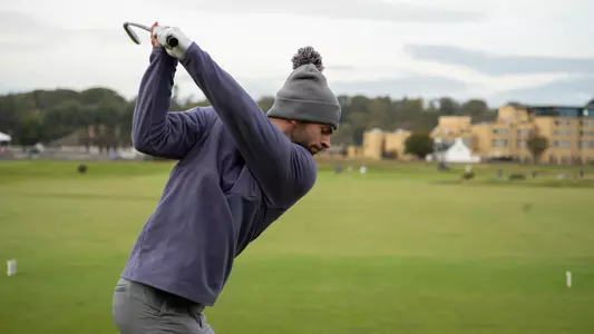 Brock Maulding hits a tee shot on the first hole at the Old Course