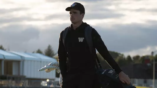 Hamish Farquharson walks with his bag on his back