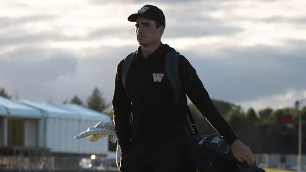 Hamish Farquharson walks with his bag on his back