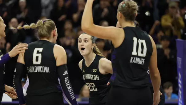 Sammy Destler celebrating a point against the Hawkeyes