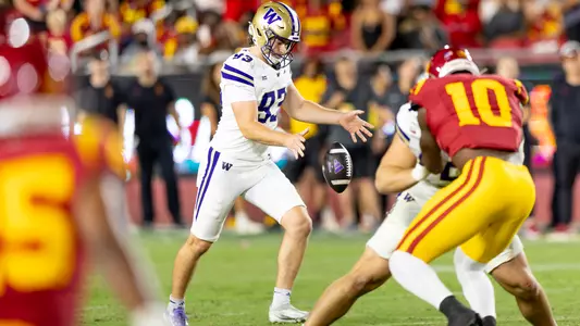 Hunter Green punts the ball against USC