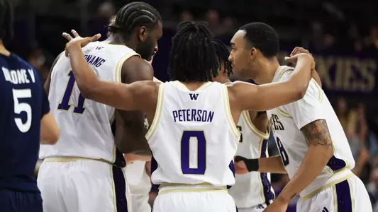 UW men's basketball huddle against Penn State
