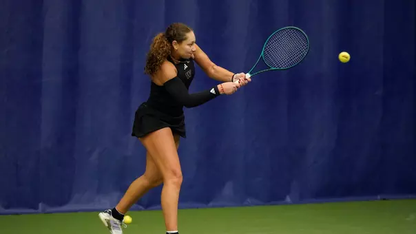 Jermine Sherif hitting a backhand in the Nordstrom Tennis Center 2025-26