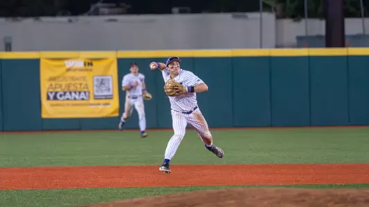 Sam DeCarlo throws out a runner from shortstop to first base against NC State.