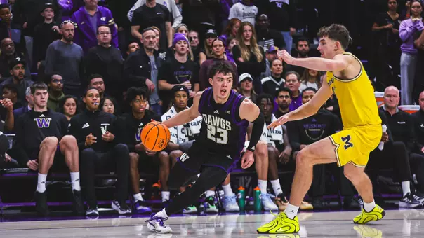 JJ Mandaquit drives vs. Michigan