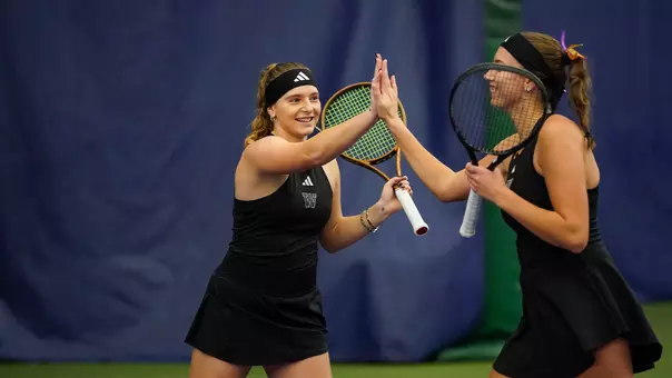 Alexia Jacobs and Marie Weissheim high five following a point