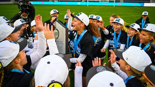 Kalea Eichenberger lifts the Big Ten Tournament Championship trophy