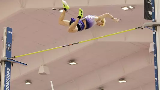 james rhoads soars over a bar in the pole vault at NCAA Indoors