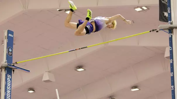 james rhoads soars over a bar in the pole vault at NCAA Indoors