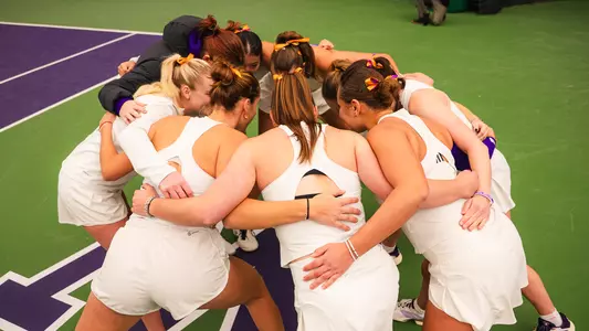 Women's tennis team huddle