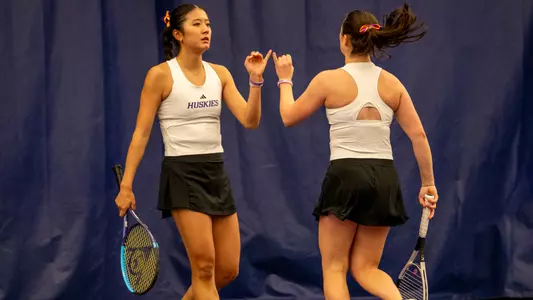 Erika Matsuda and Carina Syrtveit high five after a point