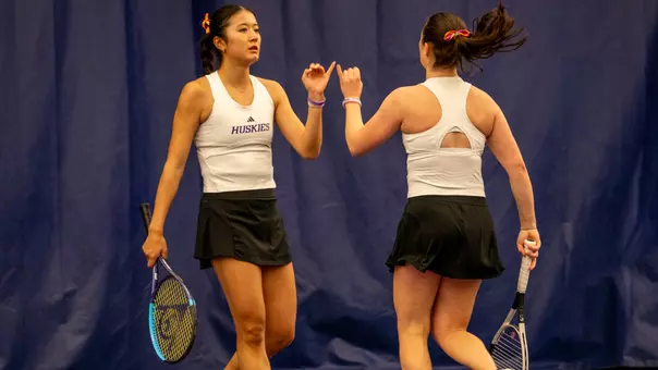 Erika Matsuda and Carina Syrtveit high five after a point