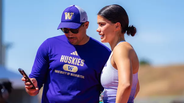 Coach Jesse Chapman reviews video with Sofia Cosculluela