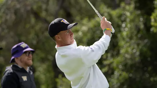 Jack Murphy watches an iron shot during the second round of the Western Intercollegiate