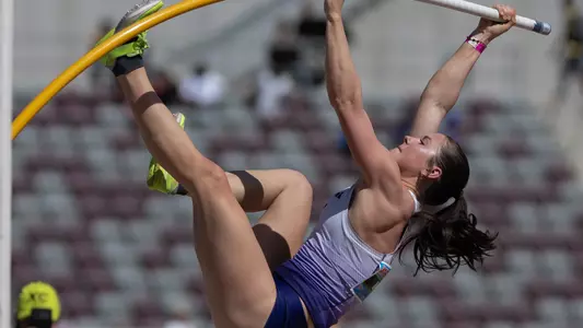 Hana Moll bending the pole in mid-air