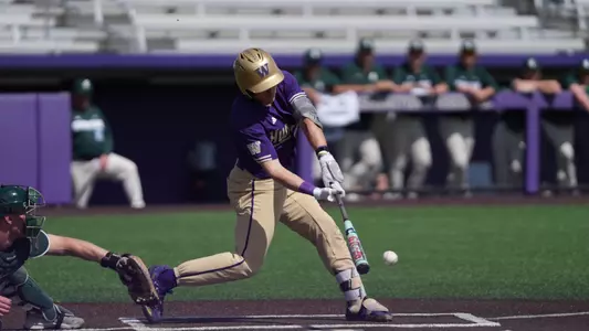 Sam DeCarlo hits a single against Michigan State.