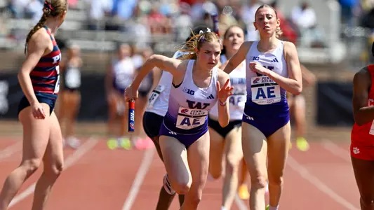 Chloe Symon takes the hand-off at the Penn Relays