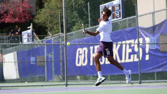 Rohan Belday hitting a forehand at Bill Quillian Stadium