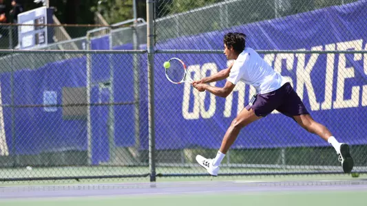 Rohan Belday reaches for a backhand