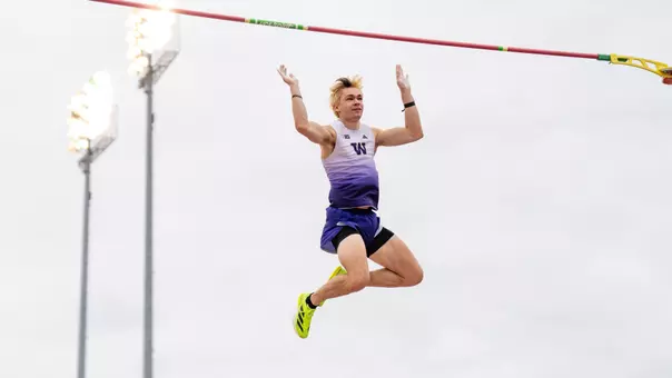 Jimmy Rhoads dropping down after clearing the pole vault bar