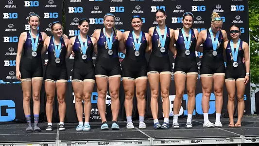 The UW womens' third varsity eight on the podium with its silver medals after winning the 2026 Big Ten Championship in Indianapolis, May 17, 2026