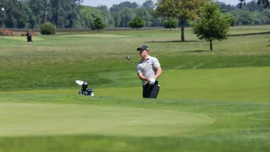Emil Herstad hits a chip on to the green during the first round of the NCAA Corvallis Regional