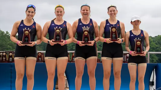 Washington women's four on the podium with ncaa third place medals and trophy, ncaa championships, may 31, 2026