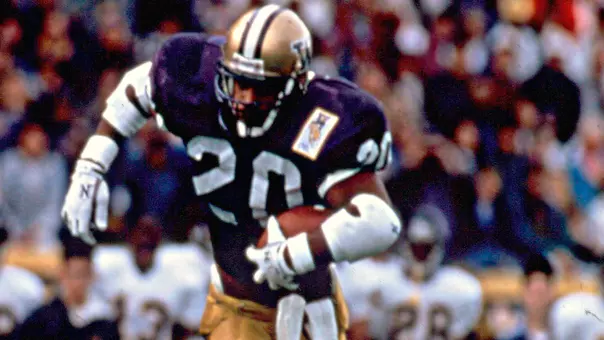 Greg Lewis runs with the ball