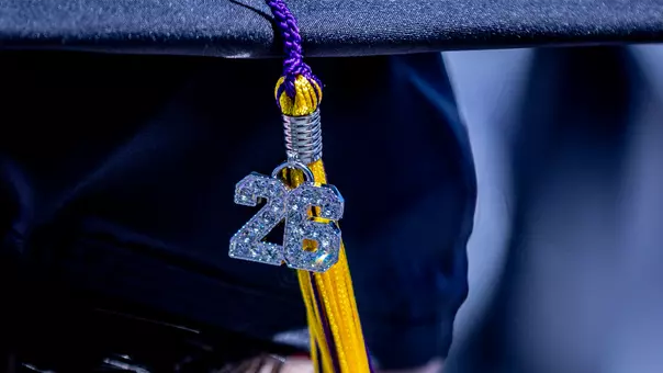 Close up of graduation cap with 26 tassel