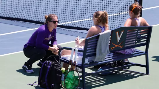 Jessie Aney talks with Marie Weissheim and Alexia Jacobs during doubles