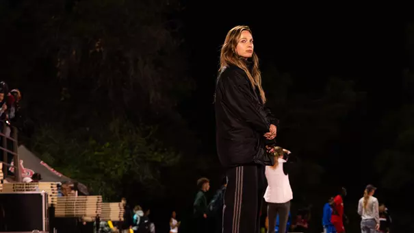 Sadie Van Arkel coaching track at Northern Arizona