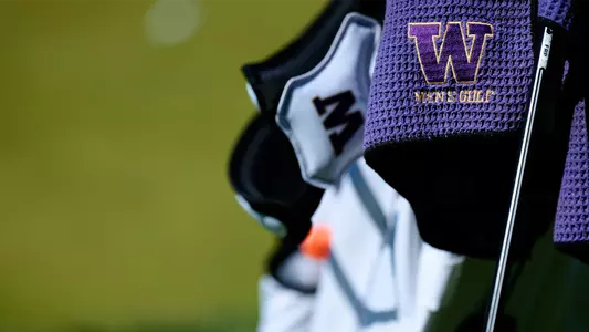 Close up shot of a W logo men's golf towel on a golf bag