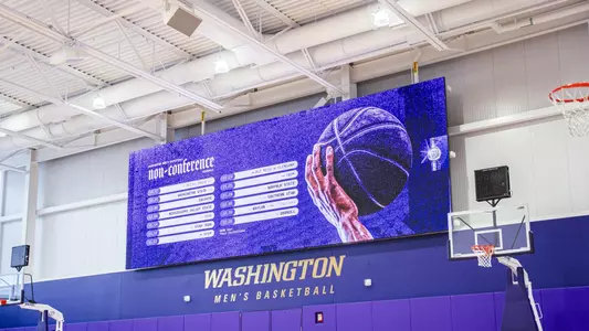 2026-27 Non-Conference Schedule Graphic on the video board at the Husky Practice Facility