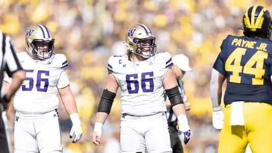 Landen Hatchett stands with the offensive line at Michigan