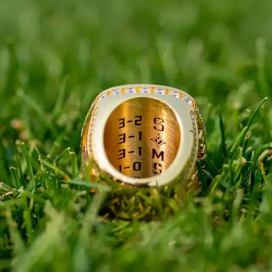 Game scores inside UW men's soccer national championship ring