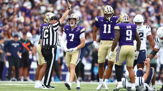 Alex McLaughlin and the Husky defense celebrate against Utah State